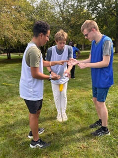 students play rock, paper, scissor to start game